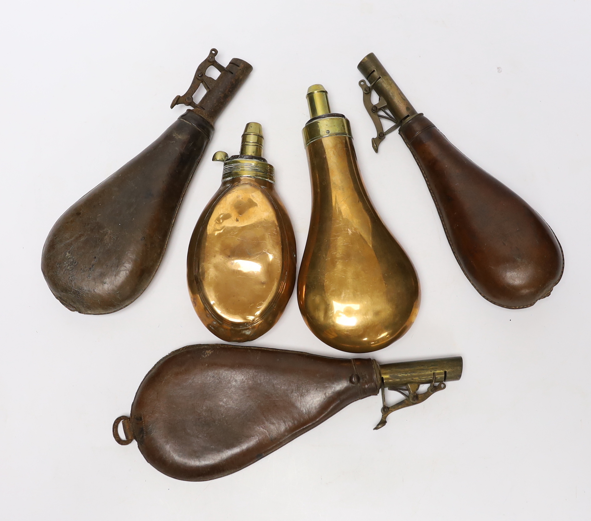 Five powder flasks; two with copper pouches and three with leather pouches